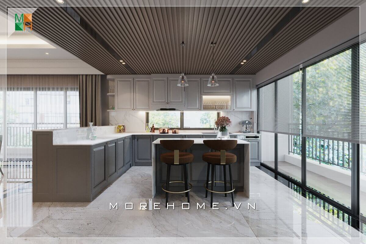 Ấn tượng với mẫu thiết kế phòng bếp không gian mở, với hệ thống tủ bếp và bàn đảo bếp bằng gỗ kết hợp mặt bàn đá nhân tạo cao cấp, lấy ánh sáng từ hệ thống cửa kính ban công cánh trượt, vừa tạo sự thông thoáng cho không gian mà phòng bếp của bạn sẽ luôn khô ráo sạch sẽ nhờ nguồn ánh sáng mặt trời tự nhiên Thiết kế phòng bếp đẹp