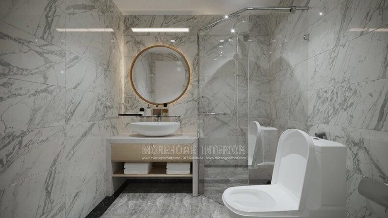 Phòng WC nổi bật với một mẫu gương trang trí được gắn đèn LED. Ngoài ra, không gian thư giãn này cũng được trang trí bằng ốp đá nhân tạo cao cấp giúp cho không gian trở nên thư giãn và chanh xả hơn.
